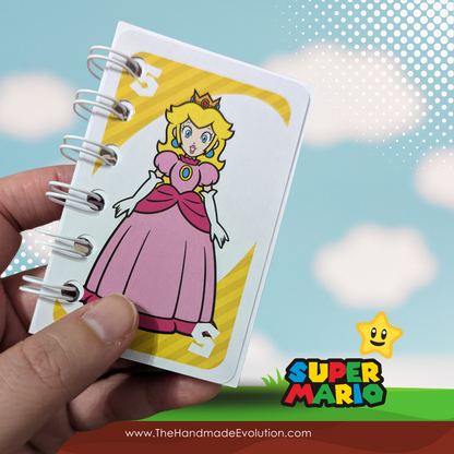 Mario themed pocket notebook. Handmade using upcycled Mario Uno Cards. Princess Peach. 