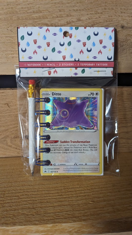 Pokémon card notebooks are packaged with a pencil, two random stickers, and two random temporary tattoos.