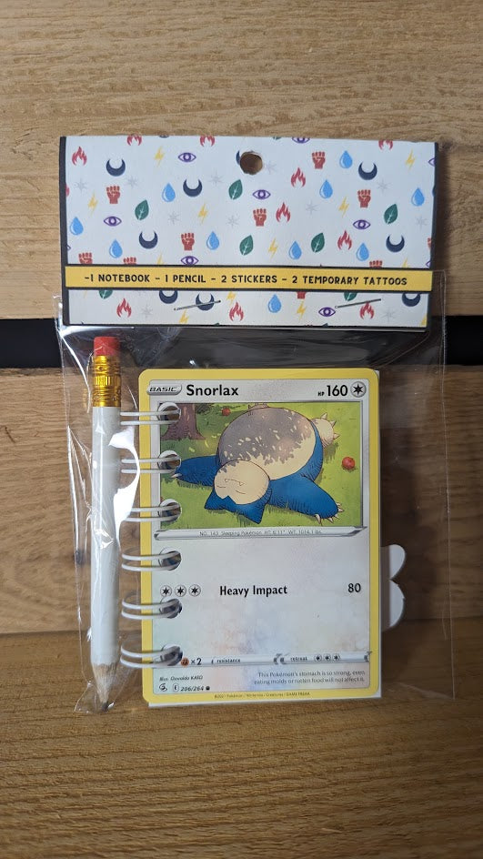 Pokémon card notebooks are packaged with a pencil, two random stickers, and two random temporary tattoos.