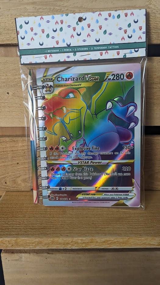 Pokémon card notebooks are packaged with a pencil, two random stickers, and two random temporary tattoos.