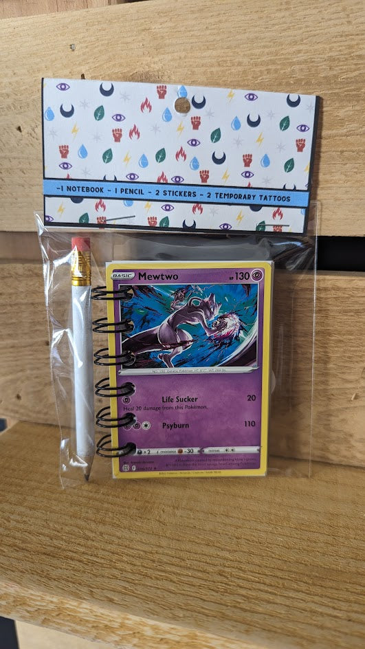 Pokémon card notebooks are packaged with a pencil, two random stickers, and two random temporary tattoos.