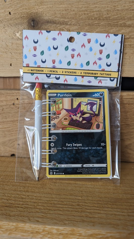 Pokémon card notebooks are packaged with a pencil, two random stickers, and two random temporary tattoos.