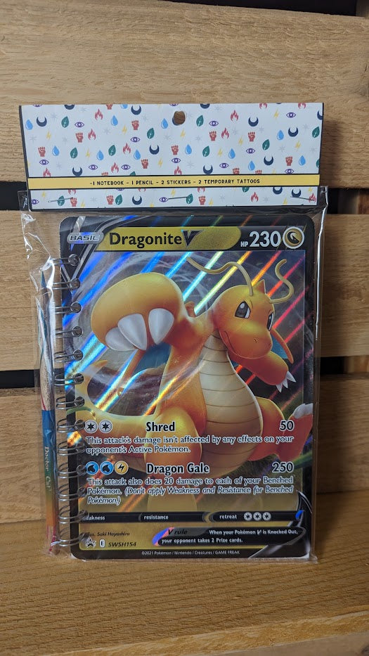 Pokémon card notebooks are packaged with a pencil, two random stickers, and two random temporary tattoos.