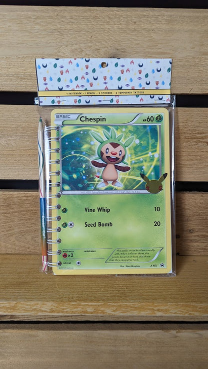 Pokémon card notebooks are packaged with a pencil, two random stickers, and two random temporary tattoos.